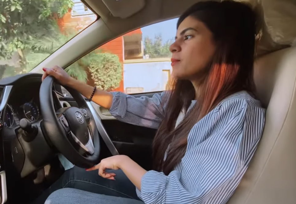 young woman driving a car